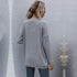 Back view of grey ribbed cardigan, showcasing relaxed fit and textured knit design