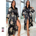Black and beige floral satin long robe with wide sleeves, worn with a city skyline in the background, showing a side view