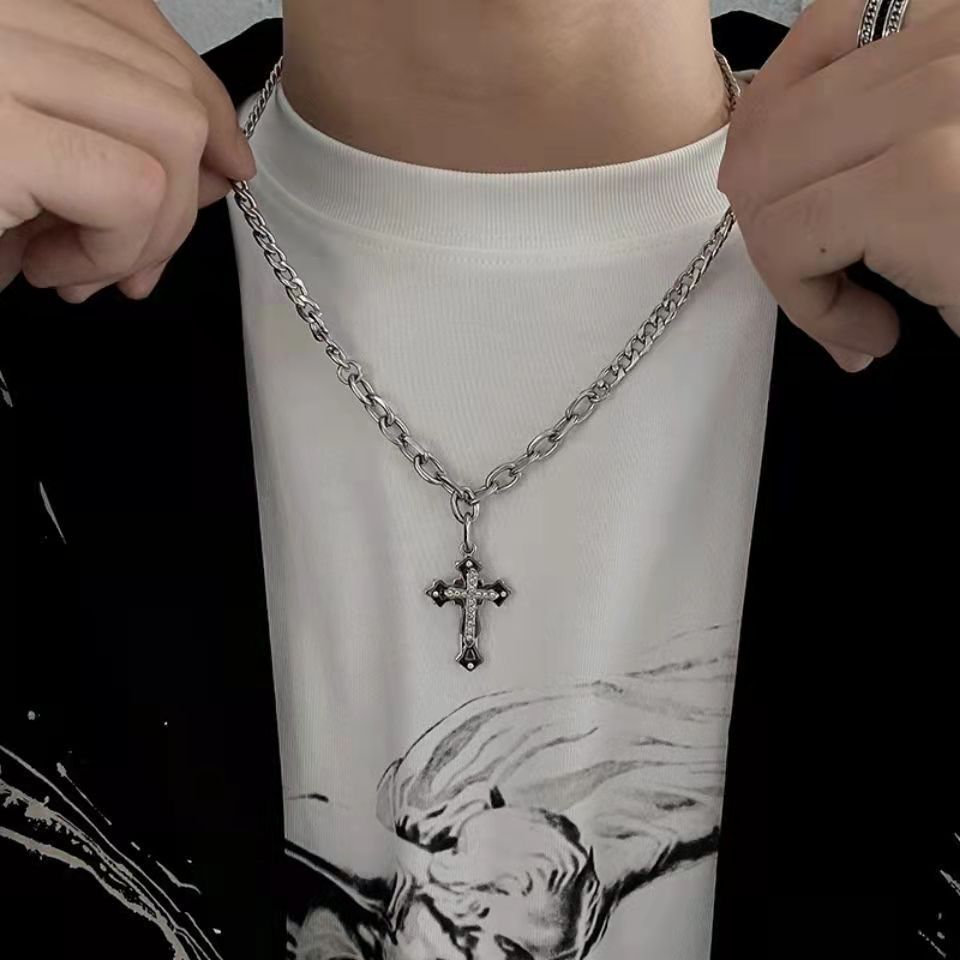 Silver chain necklace with rhinestone-studded cross pendant