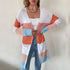 Long color-block cardigan, white crop top, gold chain necklace