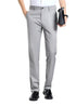 A pair of gray mulberry silk tailored pants with a waistband, held by a person with a white shirt and black shoes.