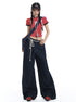 Woman wearing dark wide-leg drawstring jeans with a red crop top and cap.