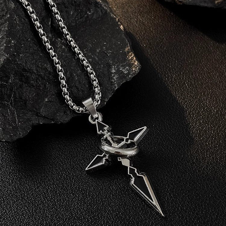 Silver modern cross pendant with black enamel accents on thick box chain displayed against dark stone background