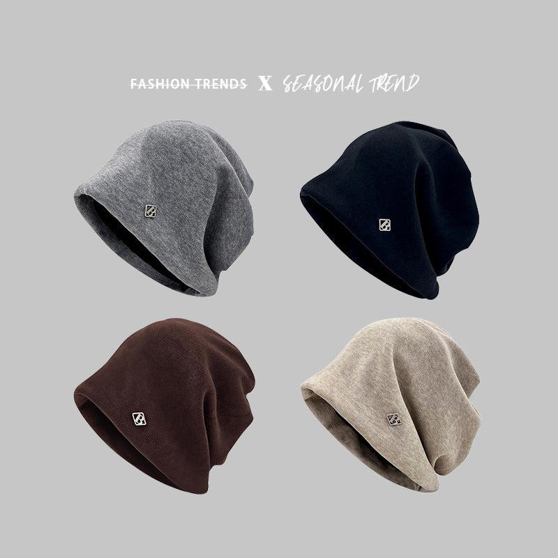 Four beanies in gray, black, brown, and beige showcasing versatile color options
