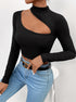 Close-up of black long-sleeve crop top with asymmetrical cutout and mock neck styling
