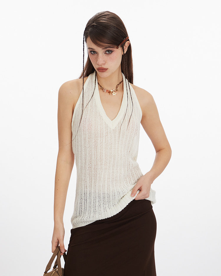 Woman wearing white halter knit tank top with brown skirt, front view