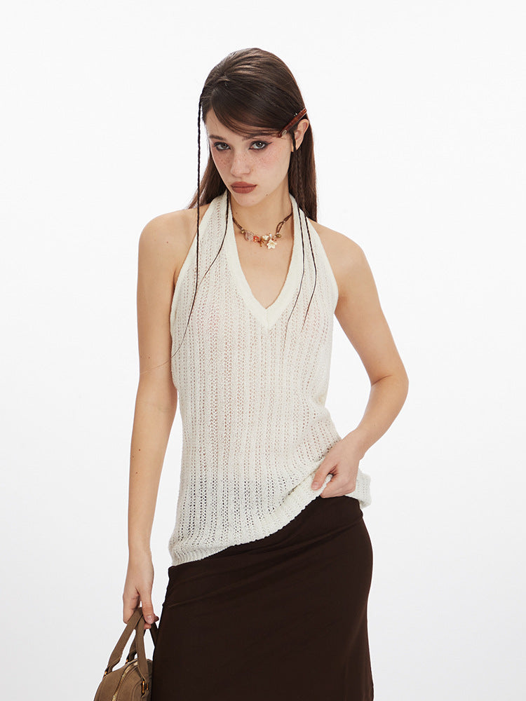 Woman wearing white halter knit tank top with brown skirt, front view