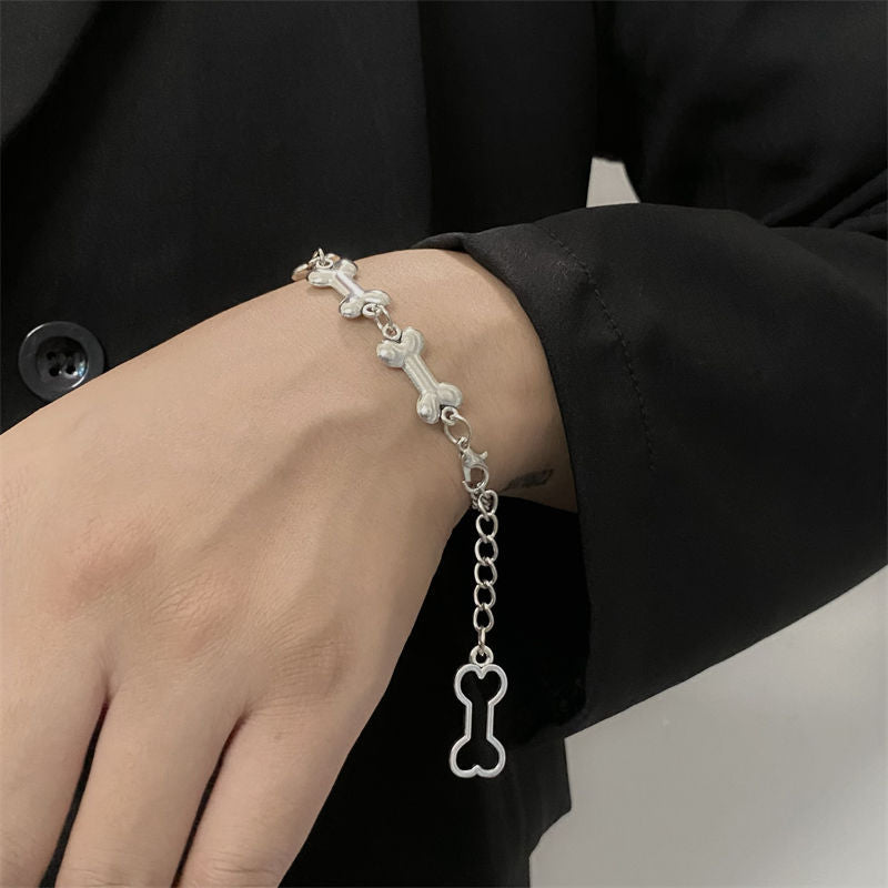 Silver dog bone chain bracelet on wrist