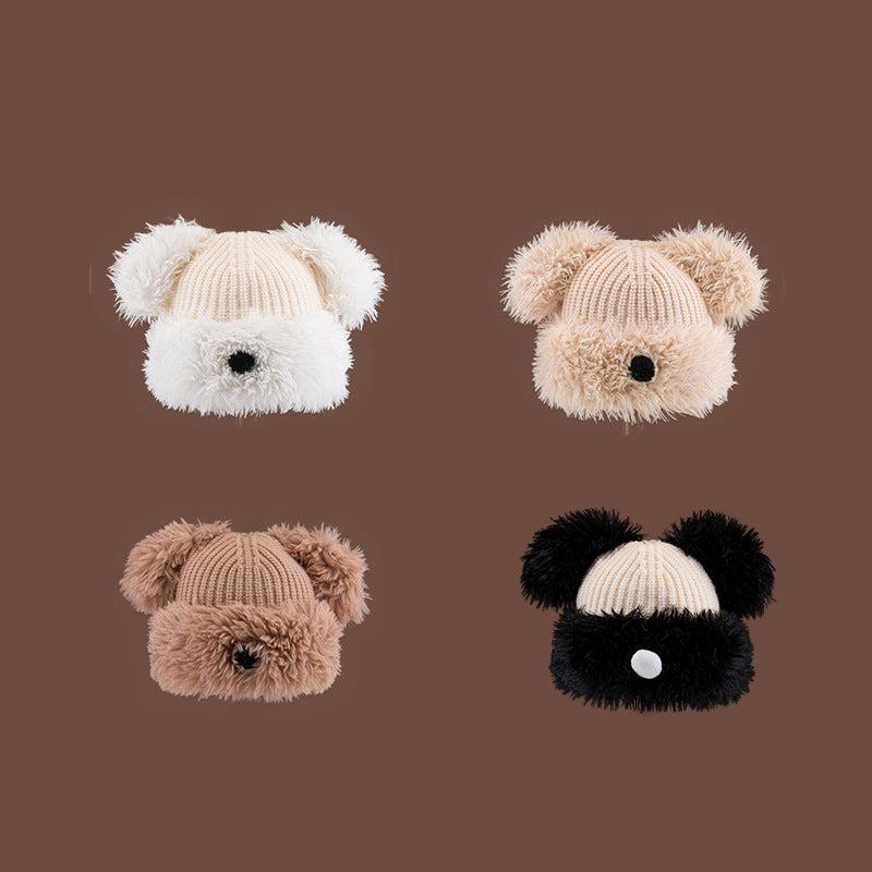 Collection of four knitted animal beanies in neutral colors - white, beige, khaki, and black, showcasing different Dog Nose Plush Knit Beanie designs