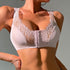 Light pink front-closure bra with delicate lace trim and hook-and-eye detail, featuring supportive design