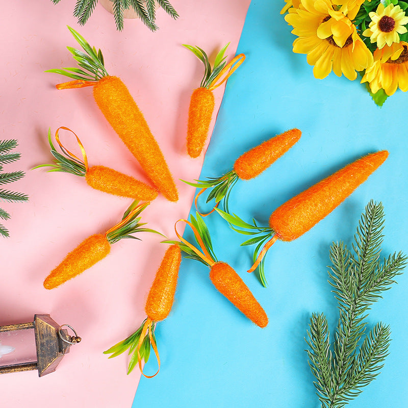  A set of artificial carrot decorations with green leaves, placed on a split pink and blue background with greenery around.