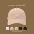 Beige baseball cap with small embroidered corgi dog logo, displayed with color variants in white, pink, navy, and black