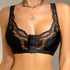 Black lace-trimmed bralette with front hook closure and gold chain necklace accessory against neutral background