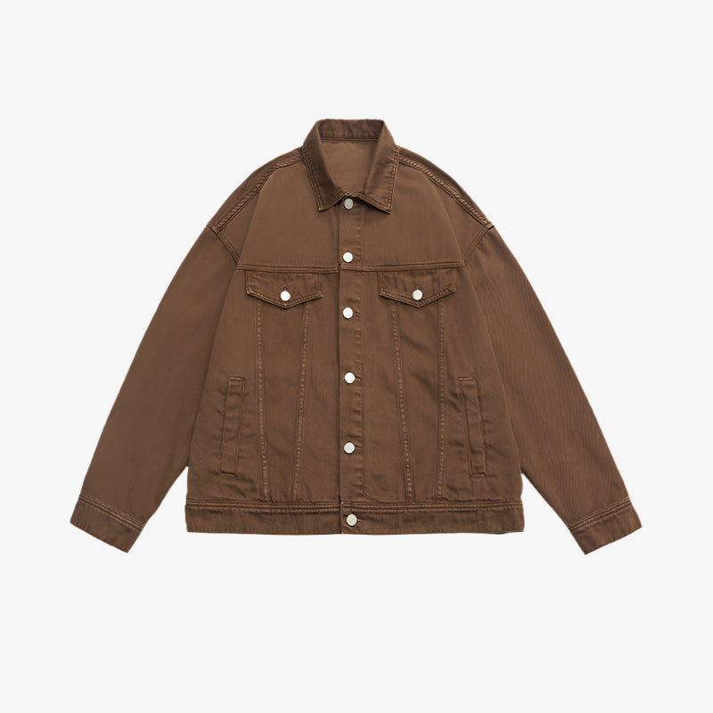 Brown denim jacket with silver buttons and dual chest pockets displayed flat against white background