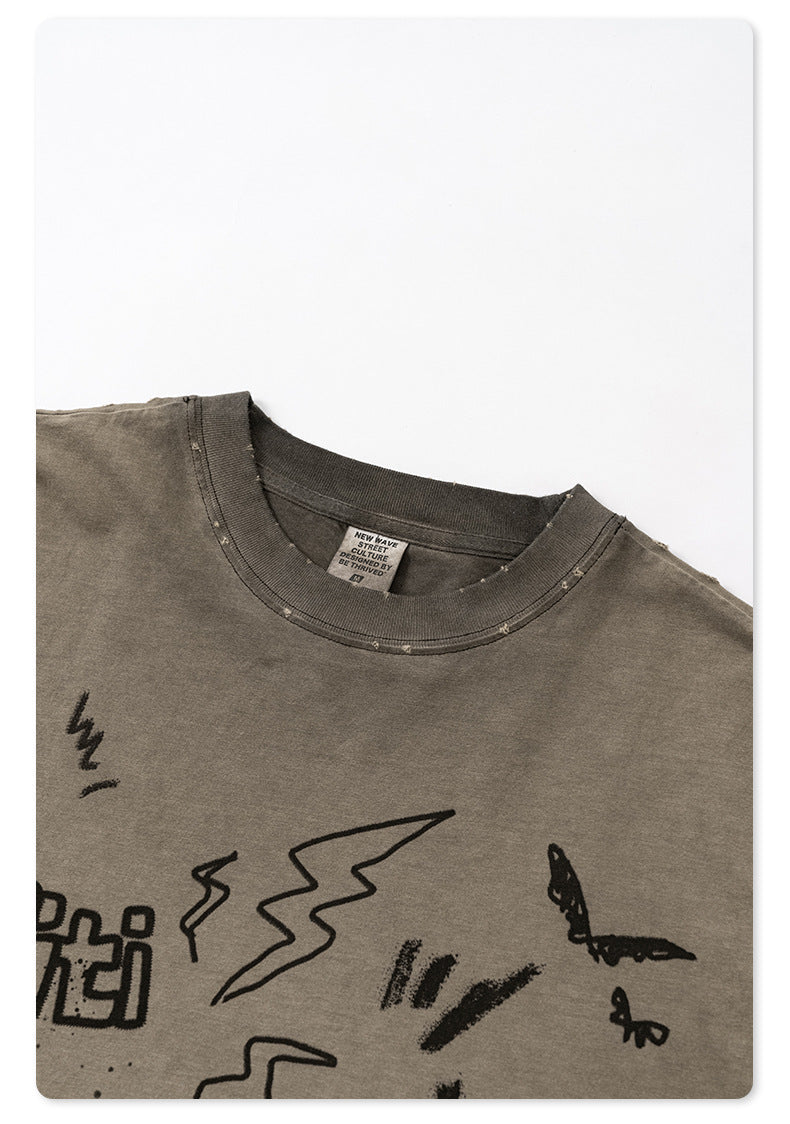 Close-up of taupe t-shirt collar detail showing New Wave Street Culture tag and distressed edge finish