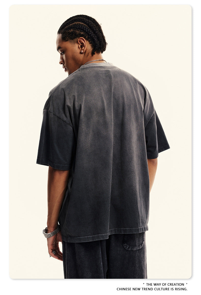 Back view of gray Breaking Tradition tee displaying premium cotton construction