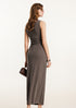 Rear view of brown ribbed bodycon maxi dress, highlighting the fit and fabric texture, accessorized with a brown handbag.