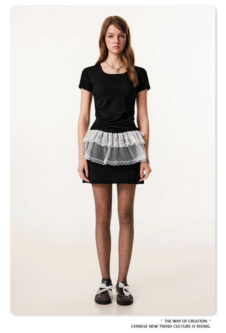 Black fitted t-shirt with white lace peplum overlay, front view