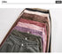 Close-up of khaki wide-leg jeans zipper detail, highlighting quality metal hardware
