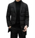Black quilted down blazer coat with notched lapels worn with turtleneck and silver watch