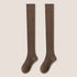 Pair of brown knee-high socks displayed flat showing full length against neutral background