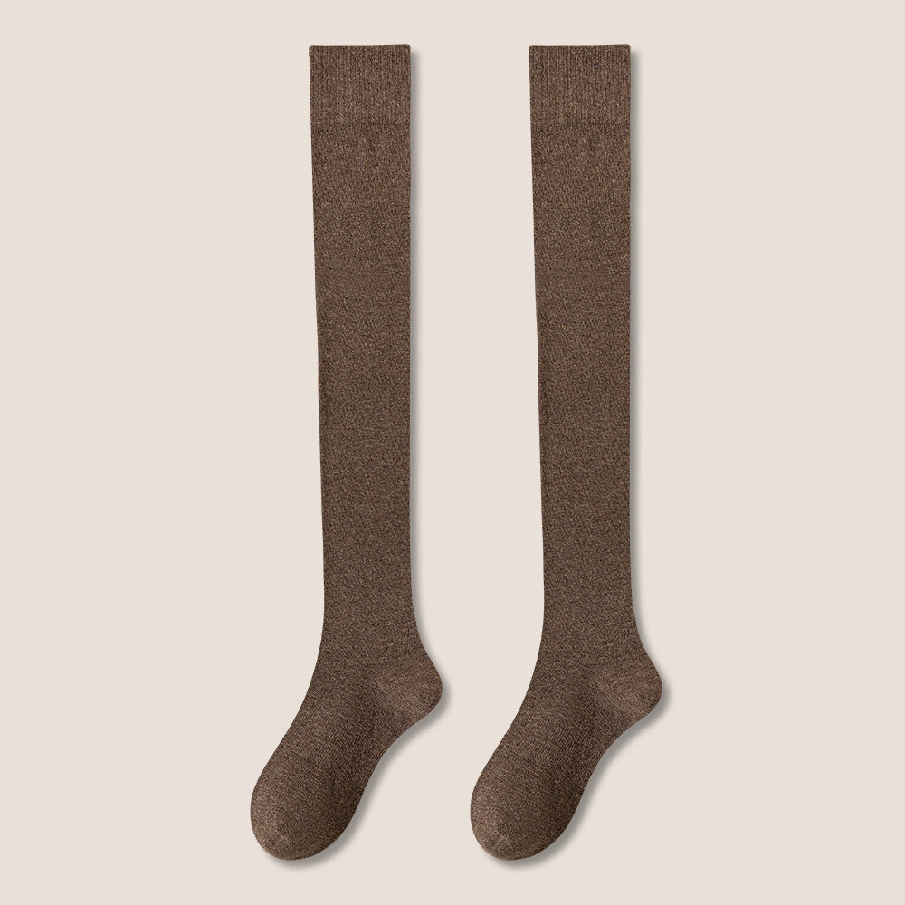 Pair of brown knee-high socks displayed flat showing full length against neutral background
