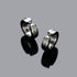 Plain silver huggie earrings on gray stone, minimal jewelry design, stainless steel hinged hoops