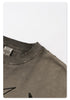 Close-up of t-shirt neckline showing distressed ribbed collar with 'NEW WAVE STREET CULTURE' brand tag