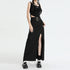 Black maxi skirt with side slit and wide studded belt, paired with crop top and platform mary janes on white background