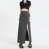 Gray high-waisted maxi skirt with belt detail and side slit, paired with black velvet crop top on white background