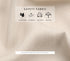 A close-up of beige fabric showing safety features including comfortable, ventilation, soft fabric, and harmless properties