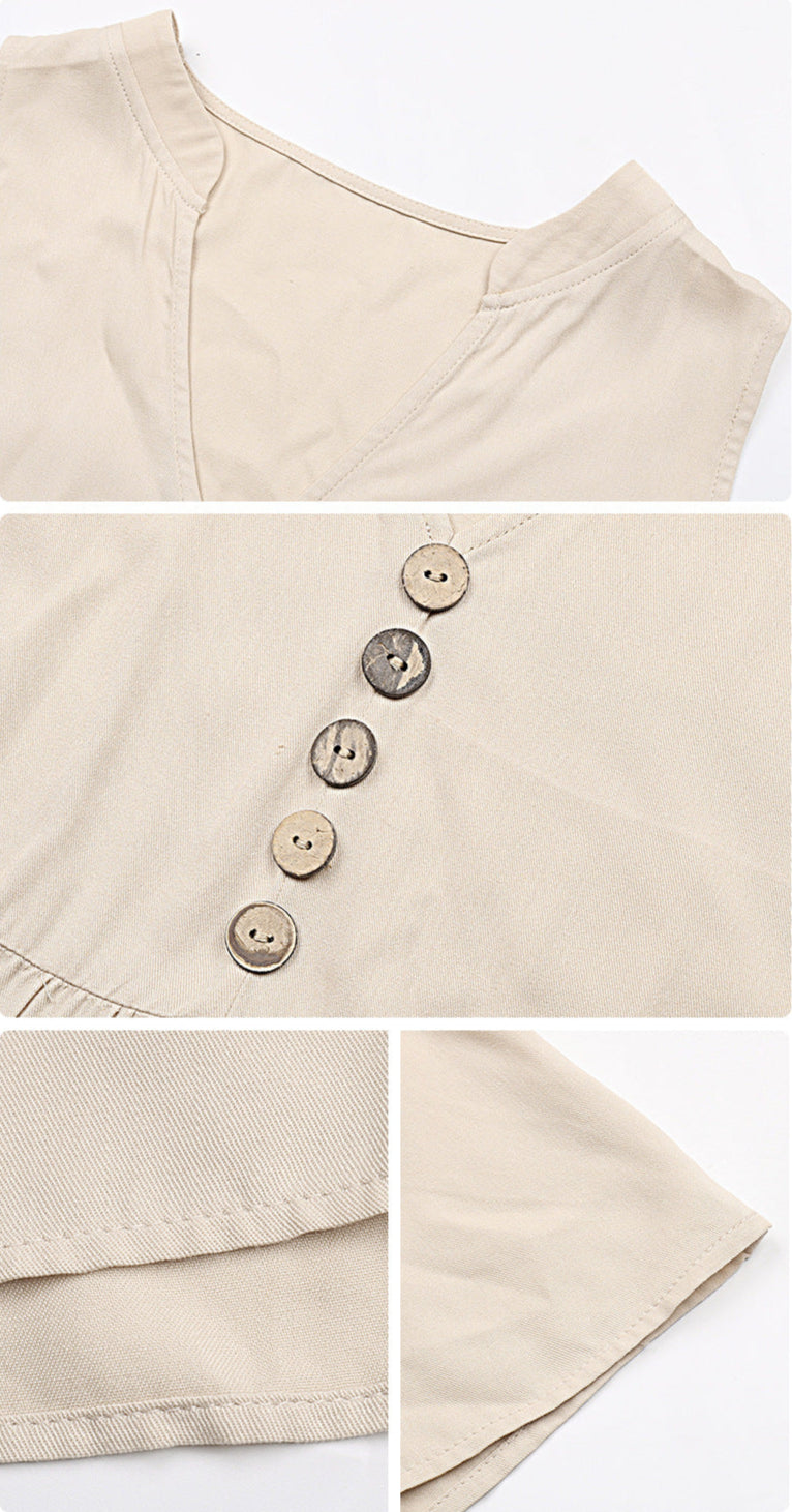 A detailed view of beige dress fabric showing v-neckline stitching and decorative button details with clean hem finishing