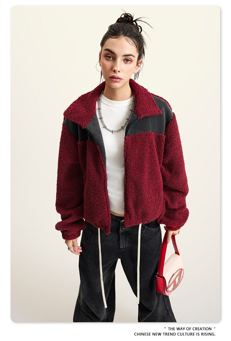 Burgundy fleece jacket with black color-block panels and full zip