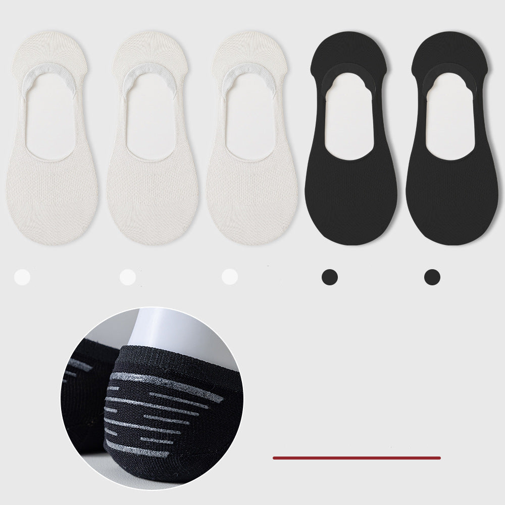 Five no-show socks arranged horizontally: three white, two black. Non-slip grip detail shown in circular inset