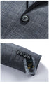 Split image showing close-up of black button detail on gray wool suit fabric and functional sleeve buttons with size tag