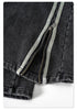 Fabric texture close-up of black denim track pants showing soft washed finish and comfortable material