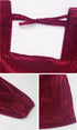 Detail shots of burgundy ribbed velvet dress showing tie back closure and textured fabric with pleated design elements