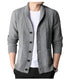 Light gray wool-blend cardigan featuring cable knit texture, black button closure, and ribbed collar displayed on mannequin with contrasting black pants