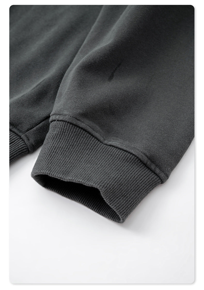 Detail shot of gray ribbed cuff and sleeve construction