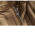 Close-up of brown wide-leg jeans zipper, demonstrating sturdy metal teeth and pull