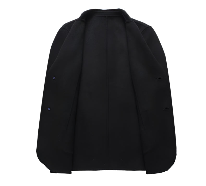 Interior view of black wool blazer showing clean lining and tailored construction with two visible buttons