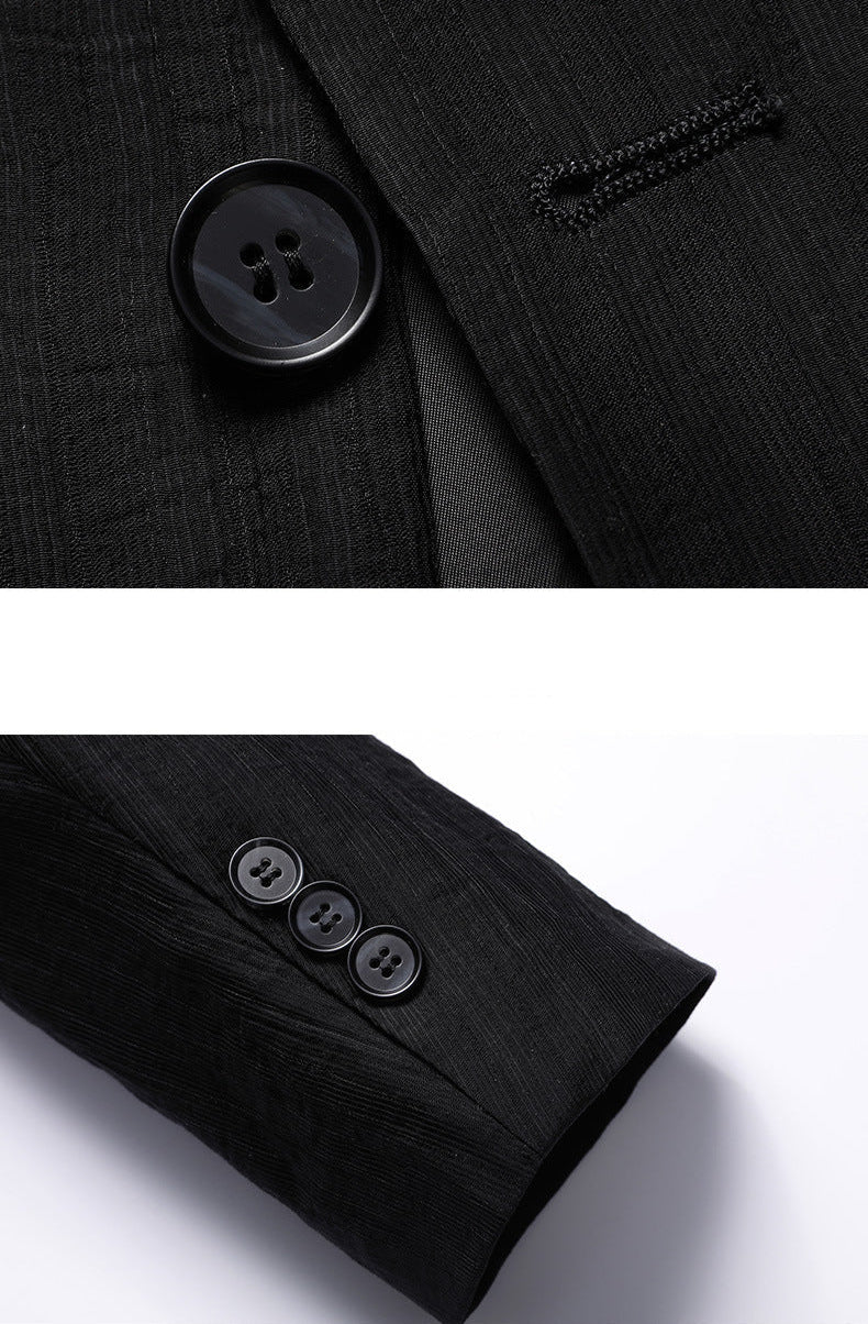 Close-up details of black textured blazer showing button and buttonhole craftsmanship and three-button functional cuff design