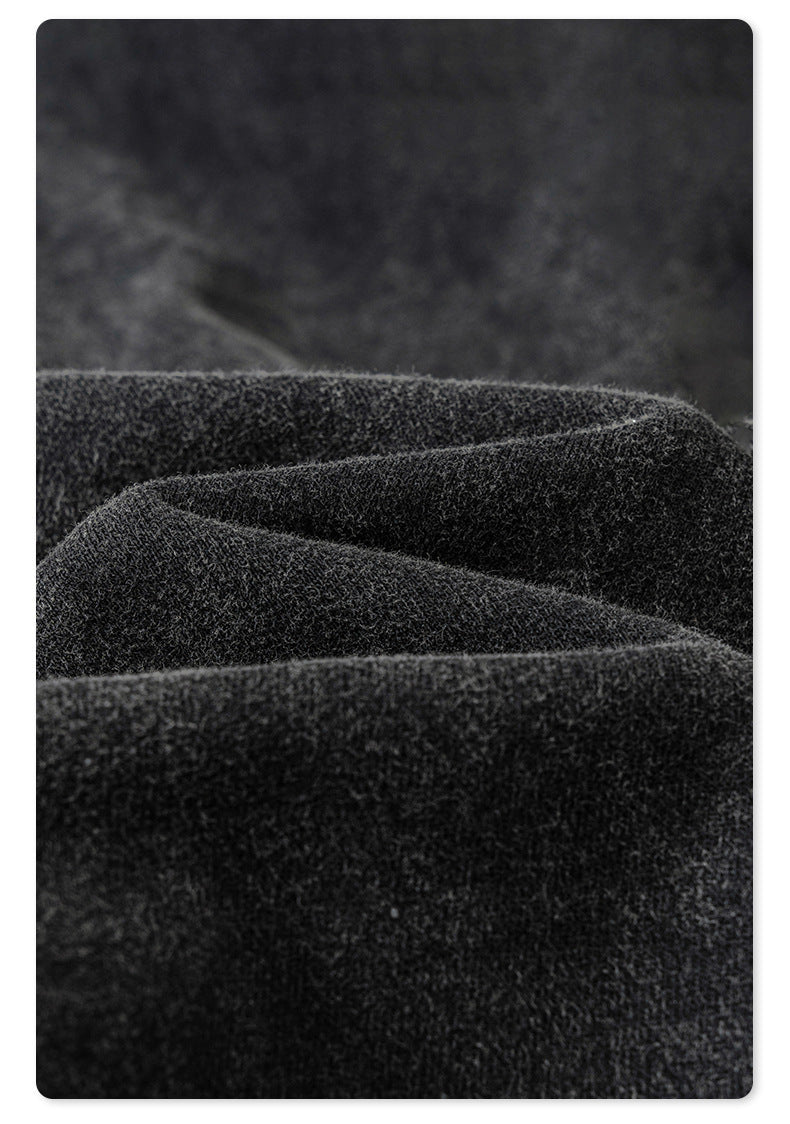 Product shot of waistband detail showing drawstring construction and front pocket on black denim joggers