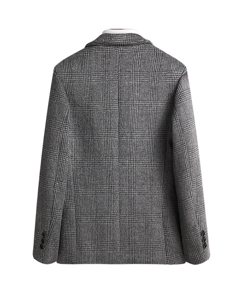 Rear view of gray glen plaid blazer displaying tailored fit, clean lines and structured shoulders. Three-button cuff detail visible