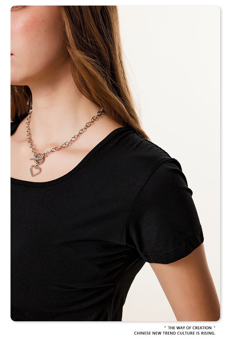 Detail of black fitted t-shirt neckline showing scoop neck construction