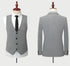 Front and back view of gray waistcoat and suit jacket on mannequins, showing plaid pattern and tailored fit