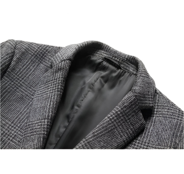 Close-up of gray glen plaid blazer collar showing smooth gray lining, precise stitching and textured wool-blend fabric with classic pattern
