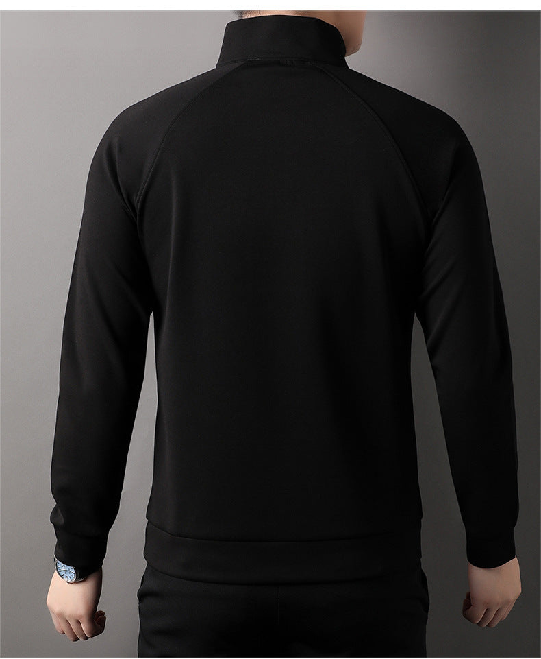 Back view of black quarter-zip pullover sweater showing clean tailoring and standing collar