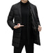 Model demonstrating black down blazer coat with one hand holding lapel to show detail
