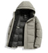 A light sage green puffer jacket partially unzipped showing black interior lining with Element brand label and technical construction